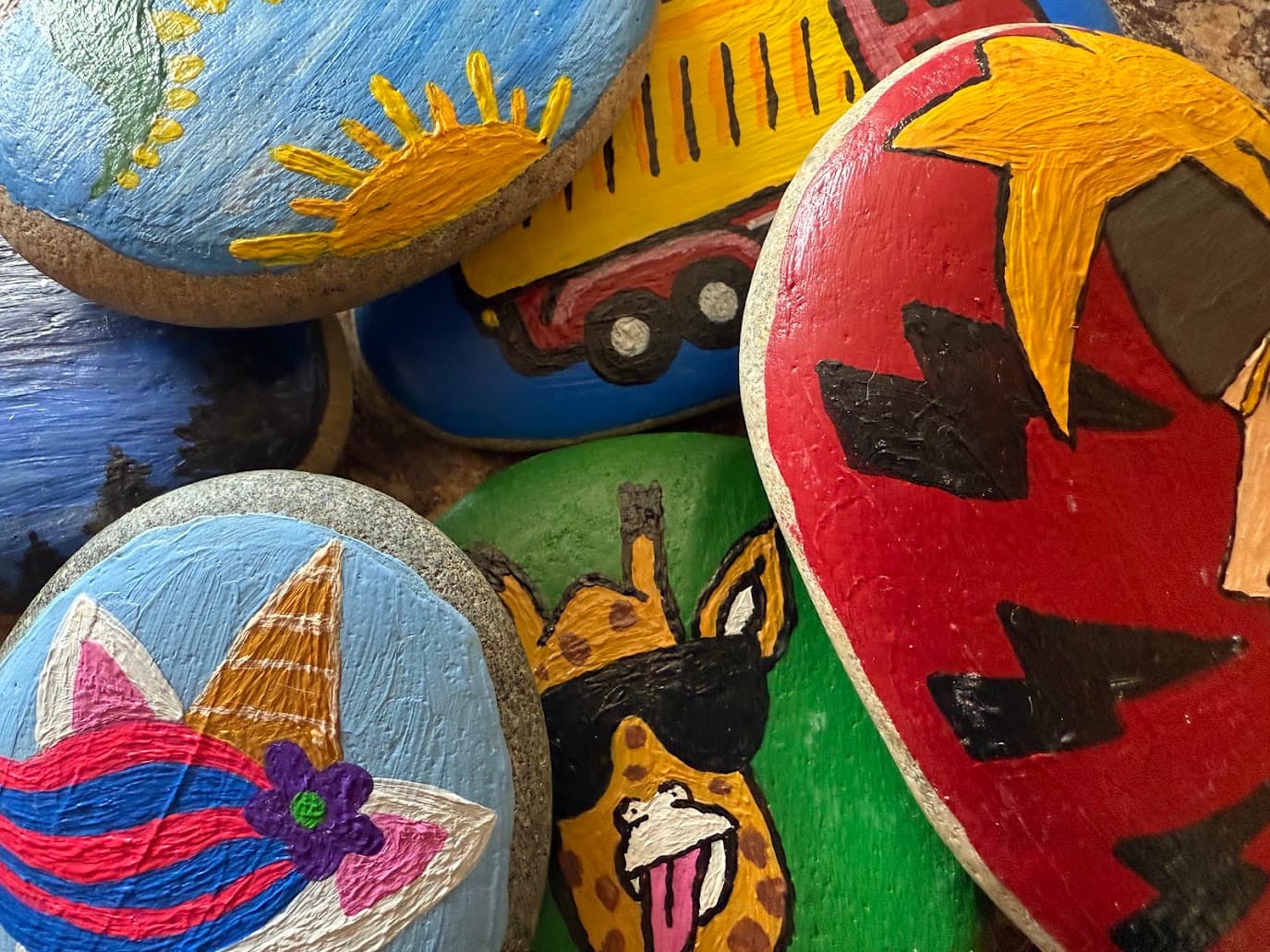 A collection of hand-painted Hitchhiker rocks